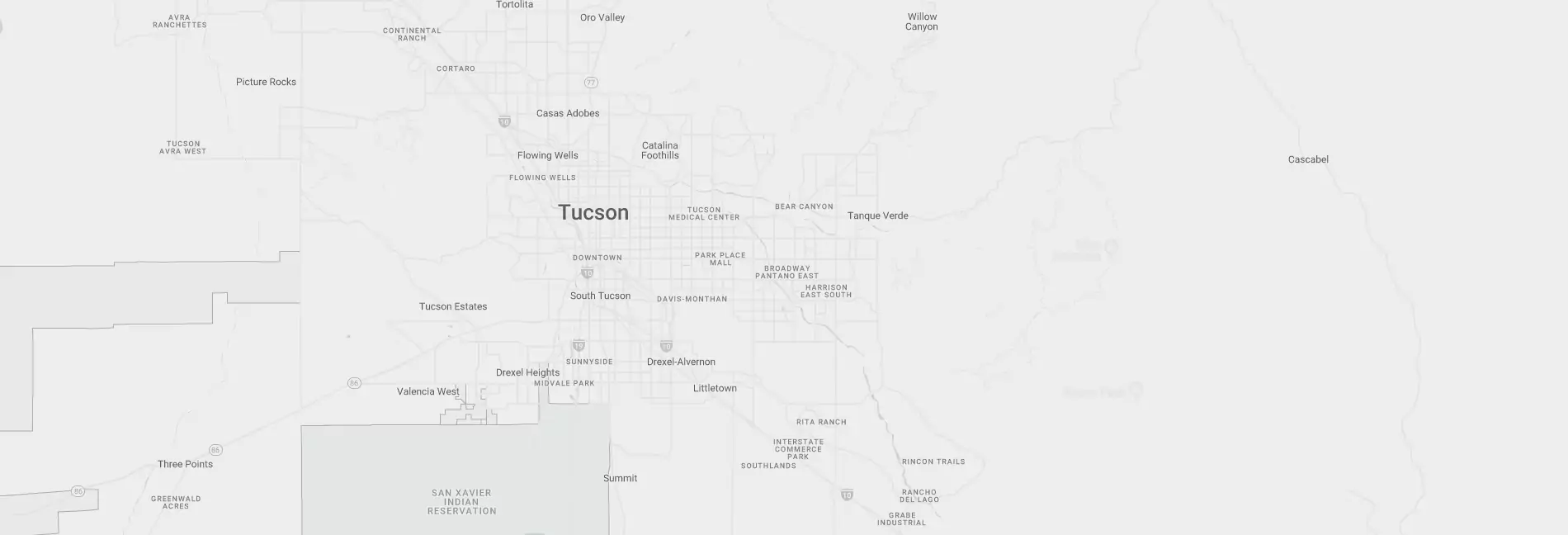 An image of the city of Tucson, Arizona that is grayed out and set as a wide background image.